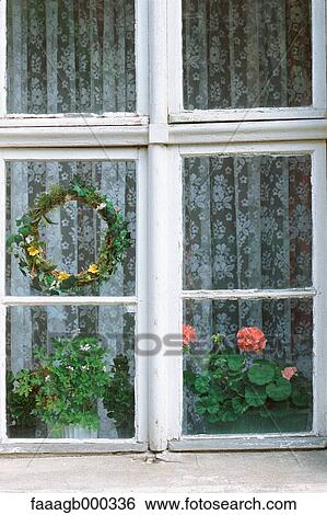 WIndow with wreath and plants View Large Photo Image Stock Photograph - WIndow with wreath and plants. Fotosearch