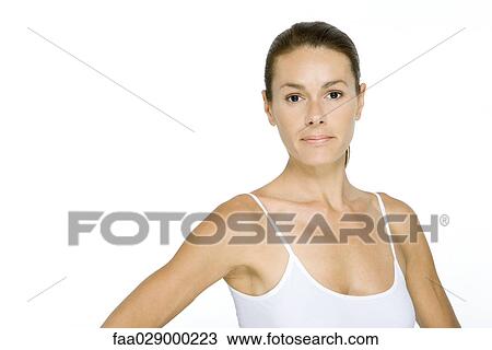 Woman in tank top looking at camera, portrait View Large Photo Image Stock Image - Woman in tank top looking at camera, portrait. Fotosearch