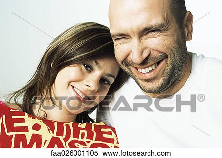 Woman leaning her head on man's shoulder, both smiling at camera View Large Photo Image Stock Photography - Woman leaning her head on man's shoulder, both smiling at camera. Fotosearch