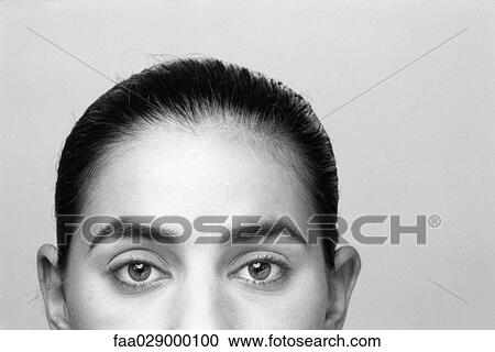 Woman looking at camera, cropped view View Large Photo Image Stock Image - Woman looking at camera, cropped view. Fotosearch