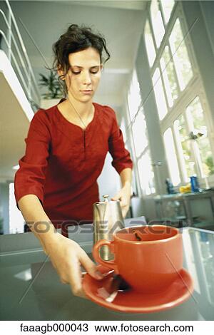 Woman picking up cup and saucer View Large Photo Image Stock Image - Woman picking up cup and saucer. Fotosearch