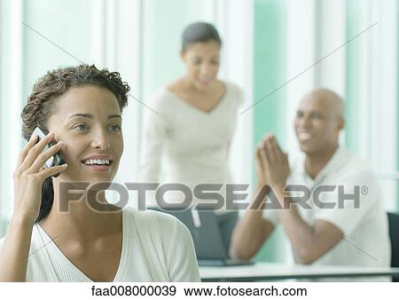 Woman using cell phone View Large Photo Image Stock Photo - Woman using cell phone. Fotosearch