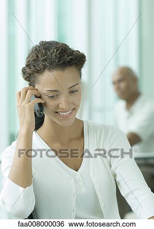 Woman using cell phone View Large Photo Image Stock Photograph - Woman using cell phone. Fotosearch