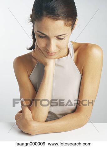 Woman wearing halter top, portrait View Large Photo Image Stock Photo - Woman wearing halter top, portrait. Fotosearch