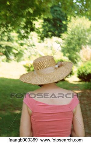 Woman wearing sunhat, rear view View Large Photo Image Stock Photo - Woman wearing sunhat, rear view. Fotosearch