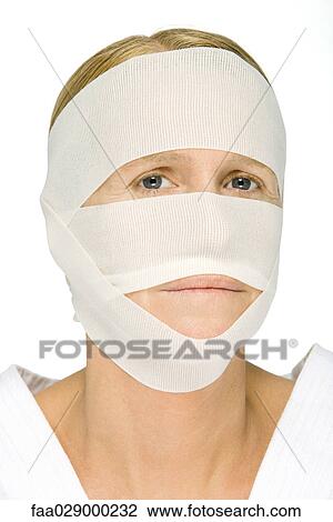Woman with bandaged face, looking at camera View Large Photo Image Stock Image - Woman with bandaged face, looking at camera. Fotosearch