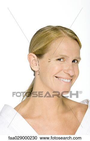 Woman with plastic surgery markings on face, smiling at camera View Large Photo Image Stock Image - Woman with plastic surgery markings on face, smiling at camera. Fotosearch