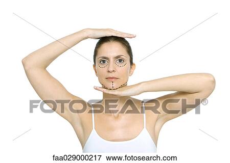 Woman with plastic surgery markings on face, framing head with hands, looking at camera View Large Photo Image Stock Photo - Woman with plastic surgery markings on face, framing head with hands, looking at camera. Fotosearch