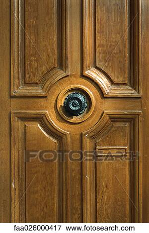 Wooden door with ornate knob, cropped view View Large Photo Image Stock Photo - Wooden door with ornate knob, cropped view. Fotosearch