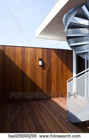 Wooden patio with spiral staircase View Large Photo Image Stock Image - Wooden patio with spiral staircase. Fotosearch