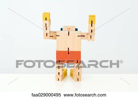 Wooden robot kneeling with head back and arms raised View Large Photo Image Stock Photography - Wooden robot kneeling with head back and arms raised. Fotosearch