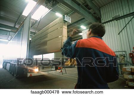 Stock Photo - Worker in warehouse. Fotosearch