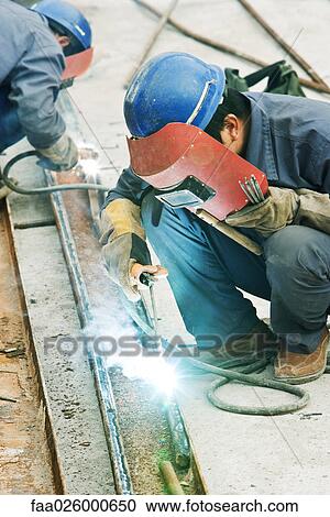 Worker using welding torch at construction site, side view View Large Photo Image Stock Image - Worker using welding torch at construction site, side view. Fotosearch