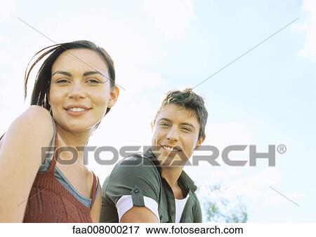 Young couple outdoors View Large Photo Image Stock Photo - Young couple outdoors. Fotosearch