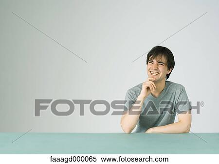 Stock Photography - Young man laughing. Fotosearch