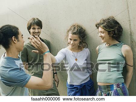 Young people hanging out View Large Photo Image Stock Photograph - Young people hanging out. Fotosearch
