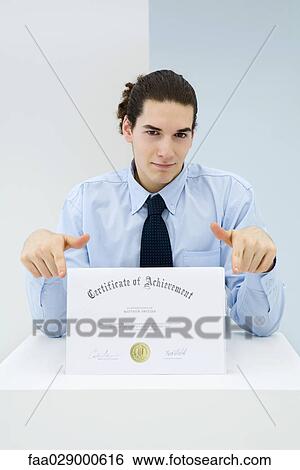 Young professional displaying certificate, portrait View Large Photo Image Stock Photograph - Young professional displaying certificate, portrait. Fotosearch