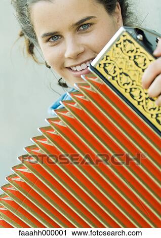 Young woman playing accordian View Large Photo Image Stock Image - Young woman playing accordian. Fotosearch