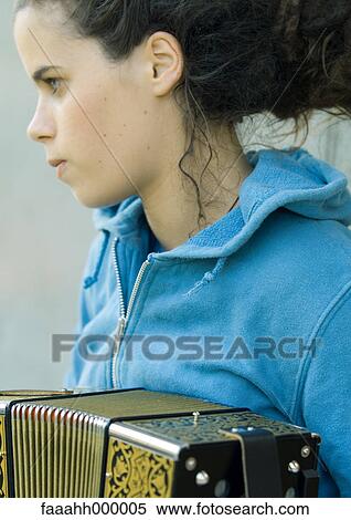 Young woman playing accordian View Large Photo Image Stock Photography - Young woman playing accordian. Fotosearch