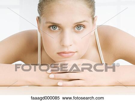 Young woman resting head on hands View Large Photo Image Stock Photography - Young woman resting head on hands. Fotosearch
