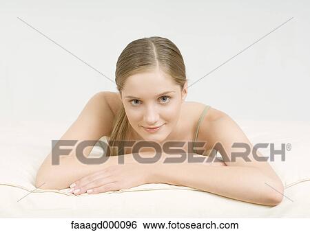 Stock Photograph - Young woman smiling. Fotosearch