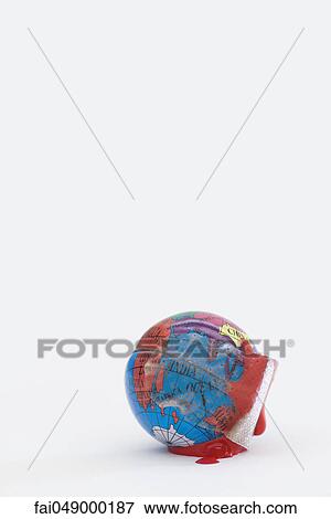 Adhesive bandage soaked in blood wrapped around globe View Large Photo Image Stock Photo - Adhesive bandage soaked in blood wrapped around globe. Fotosearch