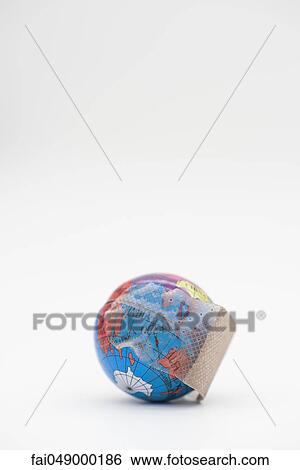 Adhesive bandage wrapped around globe View Large Photo Image Stock Photograph - Adhesive bandage wrapped around globe. Fotosearch