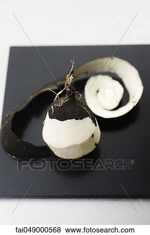 Black radish, partially peeled, revealing white flesh View Large Photo Image Stock Photo - Black radish, partially peeled, revealing white flesh. Fotosearch