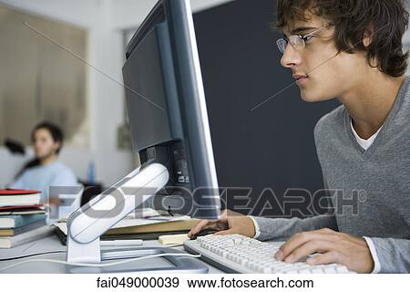 College student using computer in classroom View Large Photo Image Stock Photo - College student using computer in classroom. Fotosearch
