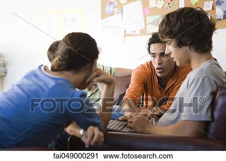 College students collaborating on laptop computer View Large Photo Image Stock Image - College students collaborating on laptop computer. Fotosearch