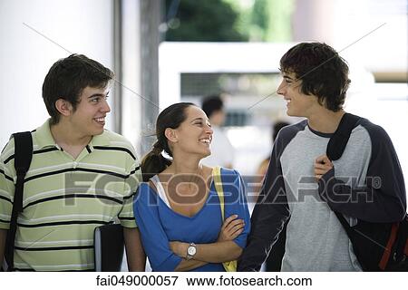 College students walking and chatting together View Large Photo Image Stock Photo - College students walking and chatting together. Fotosearch