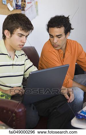 College studets collaborating with laptop computer View Large Photo Image Stock Photograph - College studets collaborating with laptop computer. Fotosearch