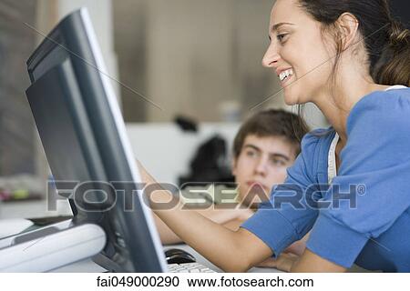 College stuents working on computer assignment View Large Photo Image Stock Image - College stuents working on computer assignment. Fotosearch