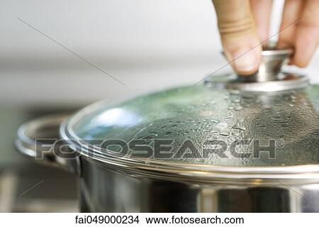 Condensation on lid of cooking pot View Large Photo Image Picture - Condensation on lid of cooking pot. Fotosearch