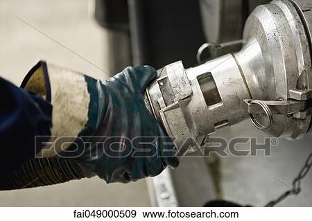 Connecting hose to fuel tanker outlet View Large Photo Image Stock Photo - Connecting hose to fuel tanker outlet. Fotosearch