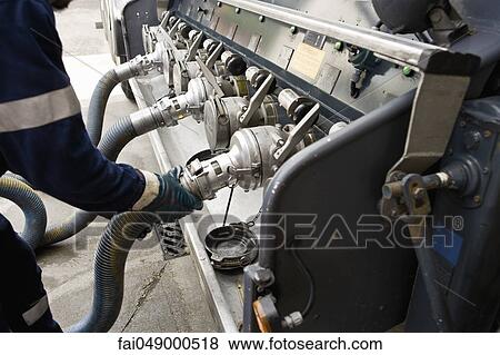 Connecting hose to fuel tanker outlet View Large Photo Image Stock Photo - Connecting hose to fuel tanker outlet. Fotosearch