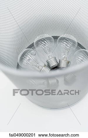 Conventional light bulbs in garbage can View Large Photo Image Stock Image - Conventional light bulbs in garbage can. Fotosearch