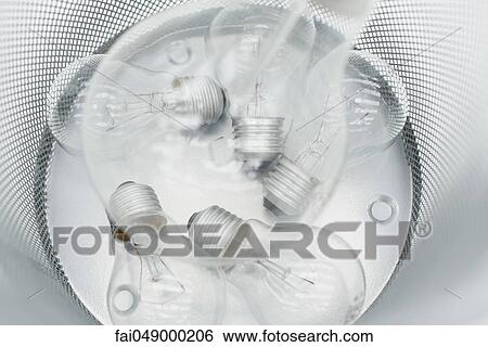 Conventional light bulbs in garbage can View Large Photo Image Stock Photograph - Conventional light bulbs in garbage can. Fotosearch