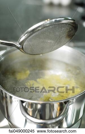 Cooking pasta View Large Photo Image Stock Photography - Cooking pasta. Fotosearch
