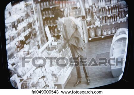 Customer browsing in convenience store, image captured by surveillance camera View Large Photo Image Stock Image - Customer browsing in convenience store, image captured by surveillance camera. Fotosearch