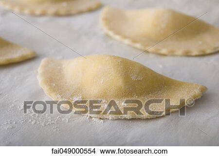 Fresh homemade mezzaluna ravioli View Large Photo Image Picture - Fresh homemade mezzaluna ravioli. Fotosearch