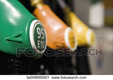 Gas pump nozzles in a row View Large Photo Image Stock Image - Gas pump nozzles in a row. Fotosearch