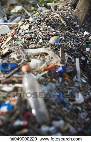 Globe in midst of landfill trash View Large Photo Image Stock Image - Globe in midst of landfill trash. Fotosearch