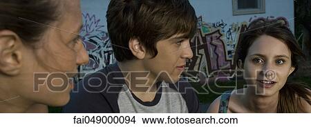 Group of young adult friends outdoors View Large Photo Image Picture - Group of young adult friends outdoors. Fotosearch
