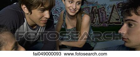 Group of young adult friends outdoors View Large Photo Image Stock Image - Group of young adult friends outdoors. Fotosearch