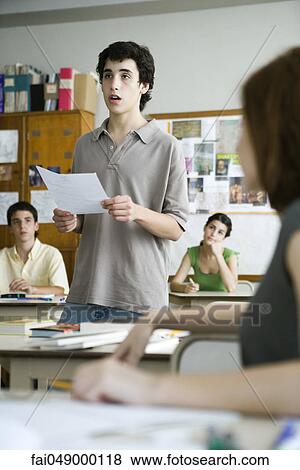 Stock Photo - High school student giving presentation in class. Fotosearch