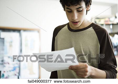 High school student reading report aloud in class View Large Photo Image Stock Photo - High school student reading report aloud in class. Fotosearch