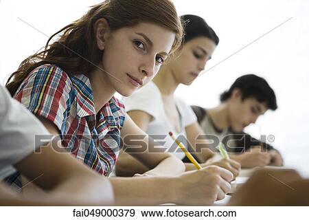 High school students busy with classwork View Large Photo Image Stock Photo - High school students busy with classwork. Fotosearch