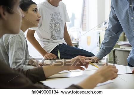 High school students, teacher in casual classroom conversation View Large Photo Image Picture - High school students, teacher in casual classroom conversation. Fotosearch