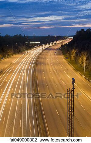 Light trails of traffic on freeway View Large Photo Image Stock Image - Light trails of traffic on freeway. Fotosearch